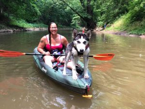 Nykole with dog in canoe