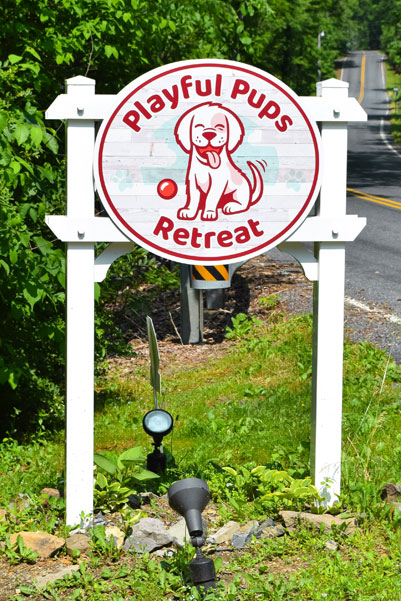 Playful Pups Retreat sign